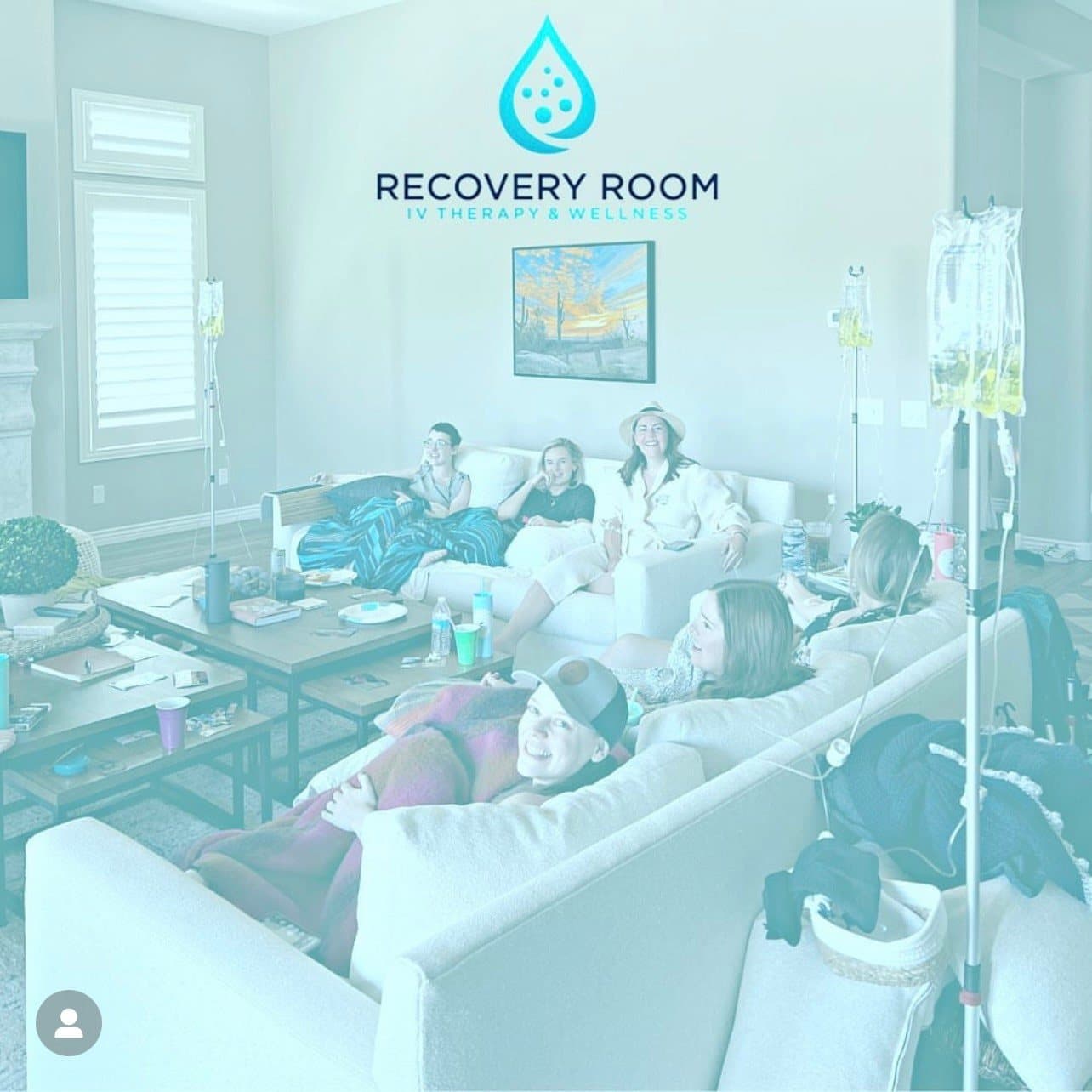 A group of friends receiving mobile IV therapy together in a living room