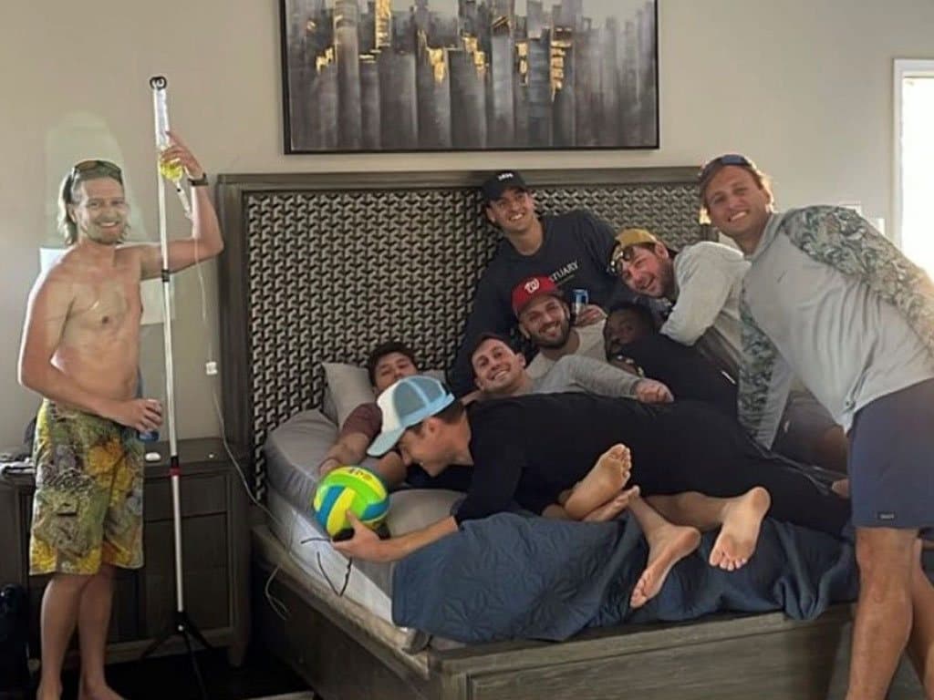 A bachelor party group recovering together with IV drips at their rental house