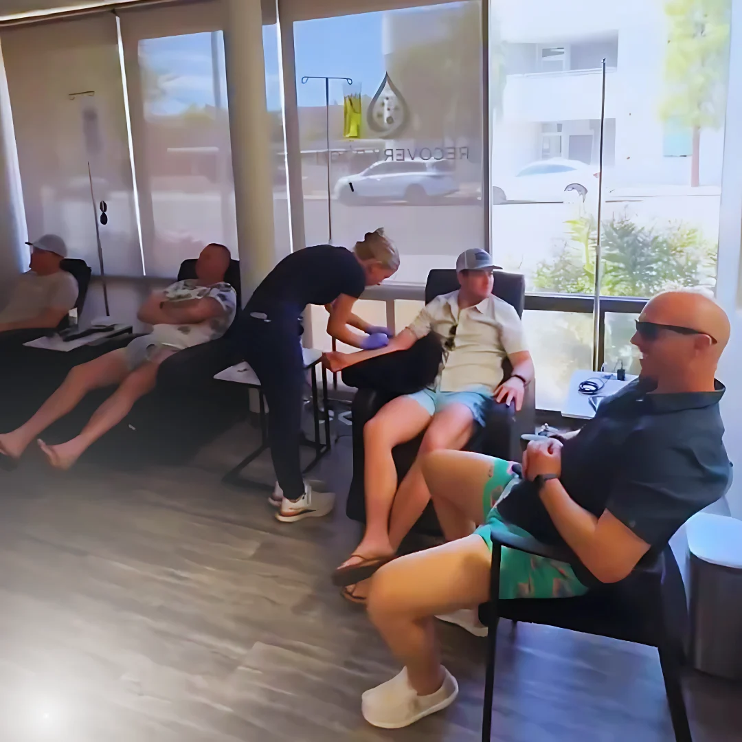 Clients relaxing in recliners during IV treatments at the Scottsdale lounge