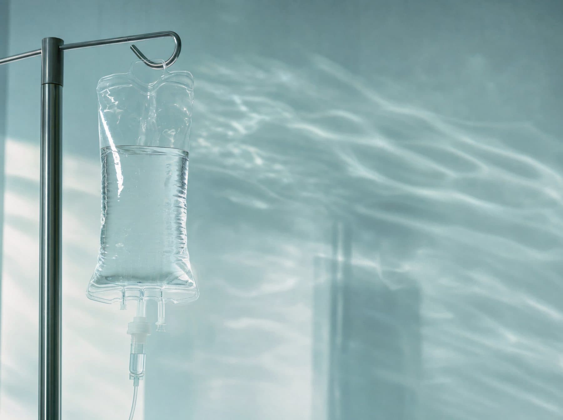 Clear IV fluid bag with soft water ripple reflections