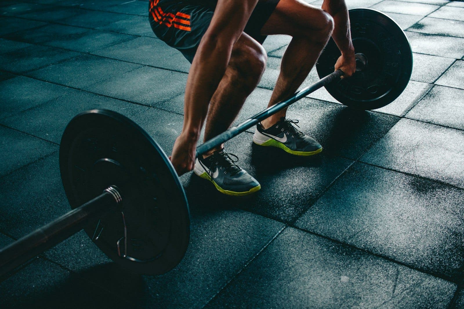 Athlete training with weights in a gym